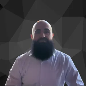 Bearded man wearing light shirt against geometric background