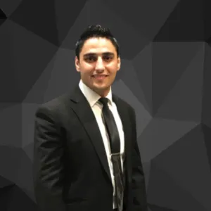 Smiling man in black suit and tie